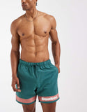 ASOS DESIGN swim shorts in mid length with placement print in green