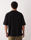 ASOS DESIGN oversized T-shirt with scenic print in black.