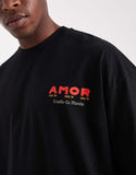 ASOS DESIGN oversized t-shirt with cartoon graphic in black.