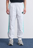 Nike Sportswear AIR - Tracksuit bottoms - photon dust/tropical twist/iron grey