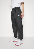 Nike Sportswear WINDRUNNER - Tracksuit bottoms - black/white