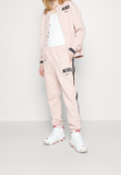 Nike Sportswear Pre-owned Tracksuit bottoms - pink