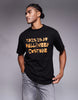 ASOS DESIGN relaxed t-shirt with slogan text graphic in black .