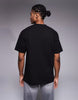 ASOS DESIGN relaxed t-shirt with slogan text graphic in black .