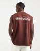 ASOS DESIGN oversized tank with text graphic in burgundy.