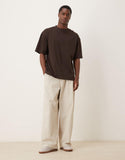 ASOS DESIGN oversized T-shirt with jazz bar graphic in brown.