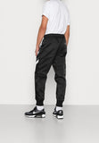 Nike Sportswear
Pre-owned
Tracksuit bottoms - black