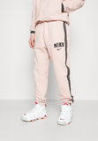 Nike Sportswear Pre-owned Tracksuit bottoms - pink
