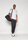 Puma LOGO PANTS - Tracksuit bottoms