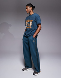 Nike Training Heritage Dri-FIT joggers in blue