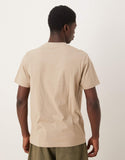 ASOS DESIGN t-shirt with high build text graphic in beige.