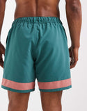 ASOS DESIGN swim shorts in mid length with placement print in green