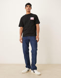 ASOS DESIGN relaxed T-shirt with color block flower graphic in black.