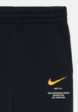 Nike Sportswear Tracksuit bottoms - black/university gold coloured