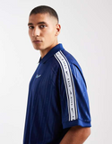 Nike striped polo top in navy