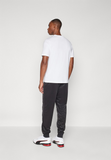 Puma LOGO PANTS - Tracksuit bottoms