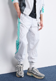 Nike Sportswear AIR - Tracksuit bottoms - photon dust/tropical twist/iron grey