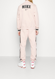 Nike Sportswear Pre-owned Tracksuit bottoms - pink