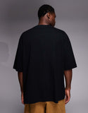 ASOS DESIGN oversized t-shirt with chest embroidery in black.