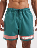 ASOS DESIGN swim shorts in mid length with placement print in green