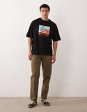 ASOS DESIGN oversized T-shirt with scenic print in black.