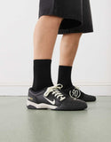 Nike T90 sneakers in black