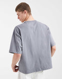 ASOS DESIGN heavyweight boxy oversized T-shirt with floral graphic in green wash.