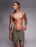 ASOS DESIGN short length swim shorts in khaki-green leopard jacquard