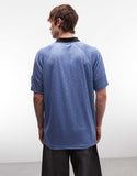 Umbro football shirt in blue and black.