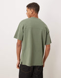 ASOS DESIGN Circular Design Collection super heavyweight relaxed t-shirt in green .