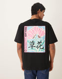 ASOS DESIGN relaxed T-shirt with color block flower graphic in black.