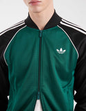 adidas Originals Superstar track top in green and black