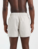 ASOS DESIGN swim shorts in short length with embroidery in beige