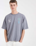 ASOS DESIGN heavyweight boxy oversized T-shirt with floral graphic in green wash.