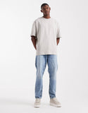 ASOS DESIGN relaxed t-shirt with street graphic in beige.