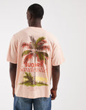 Jack & Jones oversized t-shirt with palm tree backprint in pink.