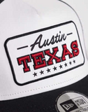 New Era Texas location patch trucker cap in black/white