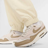 Nike Club woven tracksuit bottoms in beige