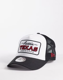 New Era Texas location patch trucker cap in black/white